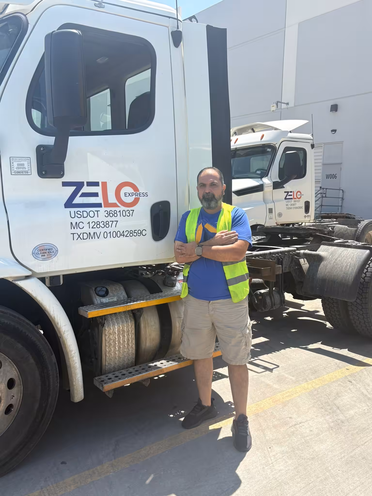 Zelo Express team member with fleet vehicles providing expert trailer spotting and yard management solutions Texas
